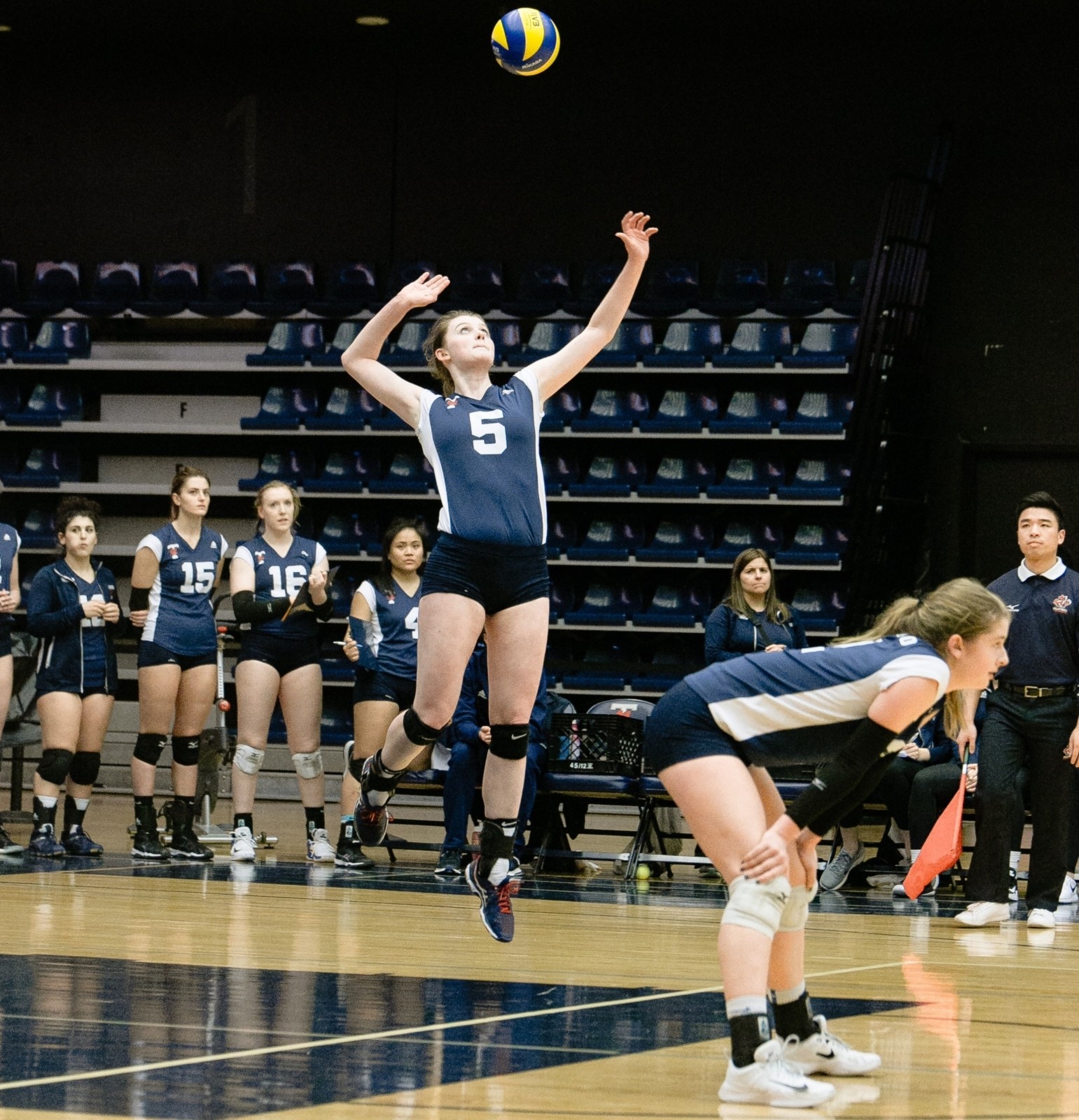 ladies youth volleyball player spiking