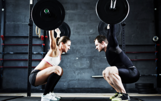 man and woman lifting weights - rotator cuff injuries and tears