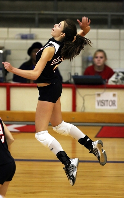 youth volleyball player spiking